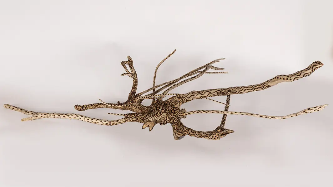 tattooed wood art piece