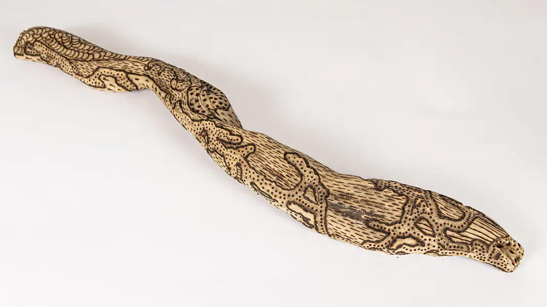 tattooed wood art piece