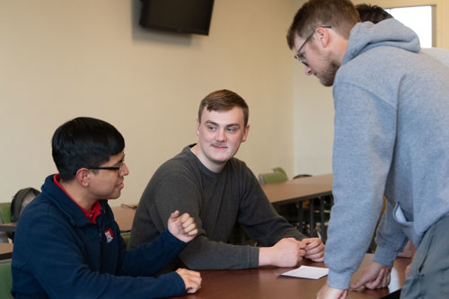 Management students have a classroom discussion