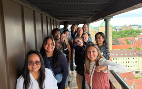 Students atop a tall bell tower 