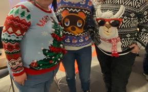 Three contestants in ugly sweater contest