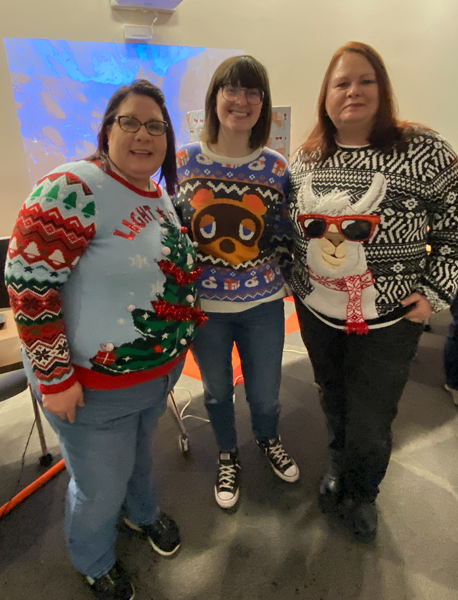 Three contestants in ugly sweater contest