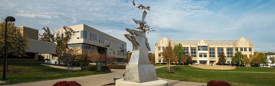 Statue on the Quad with the Business and Engineering Center and the Liberal Arts Center in the background