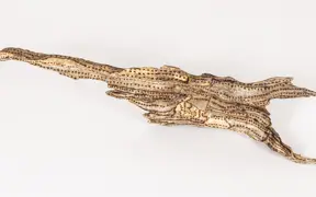 tattooed wood art piece