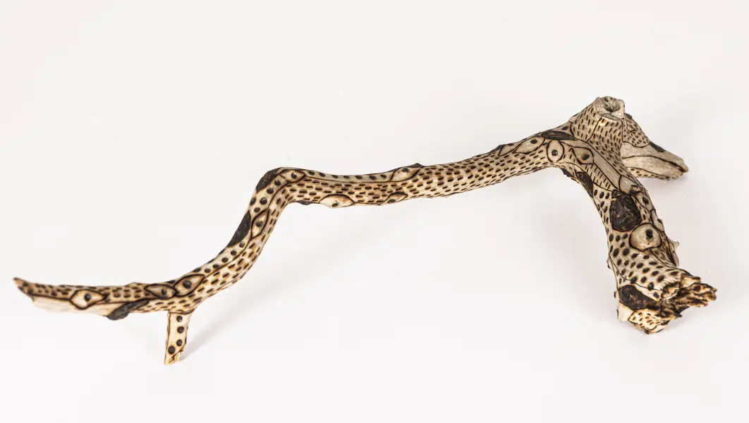 tattooed wood art piece