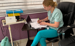 Faculty member collecting data at Trinity Hospital