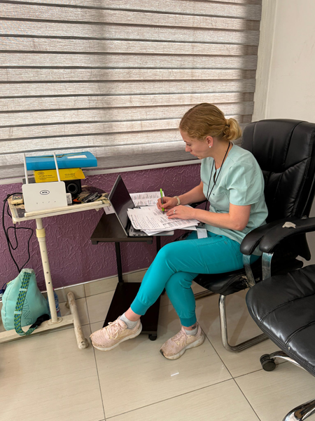 Faculty member collecting data at Trinity Hospital