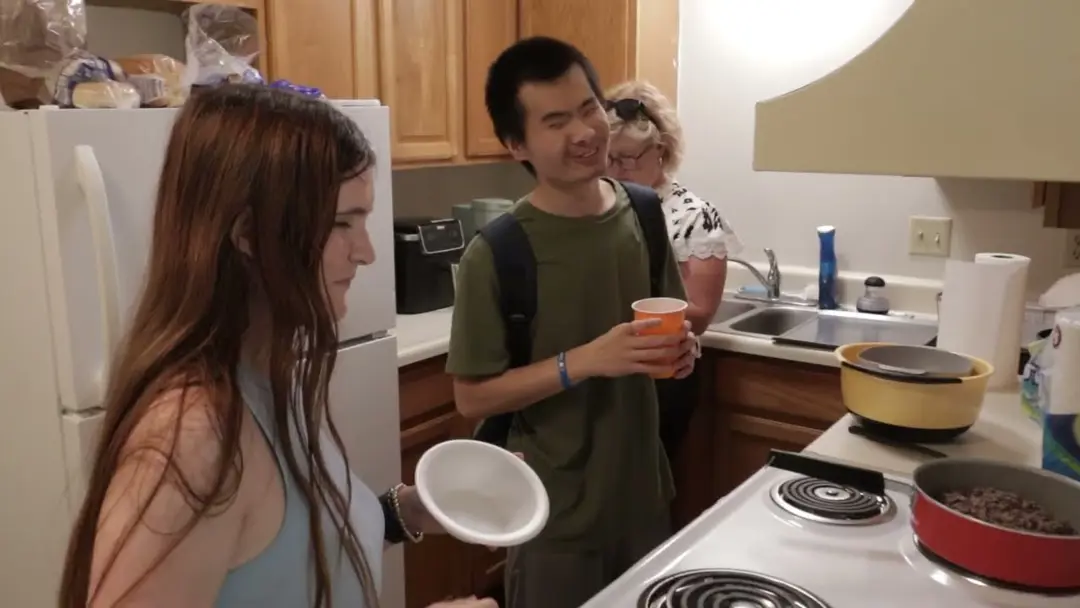 Students prepare a meal in their on-campus apartment