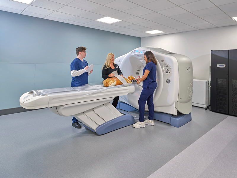 Photo of faculty and students at the CT simulator