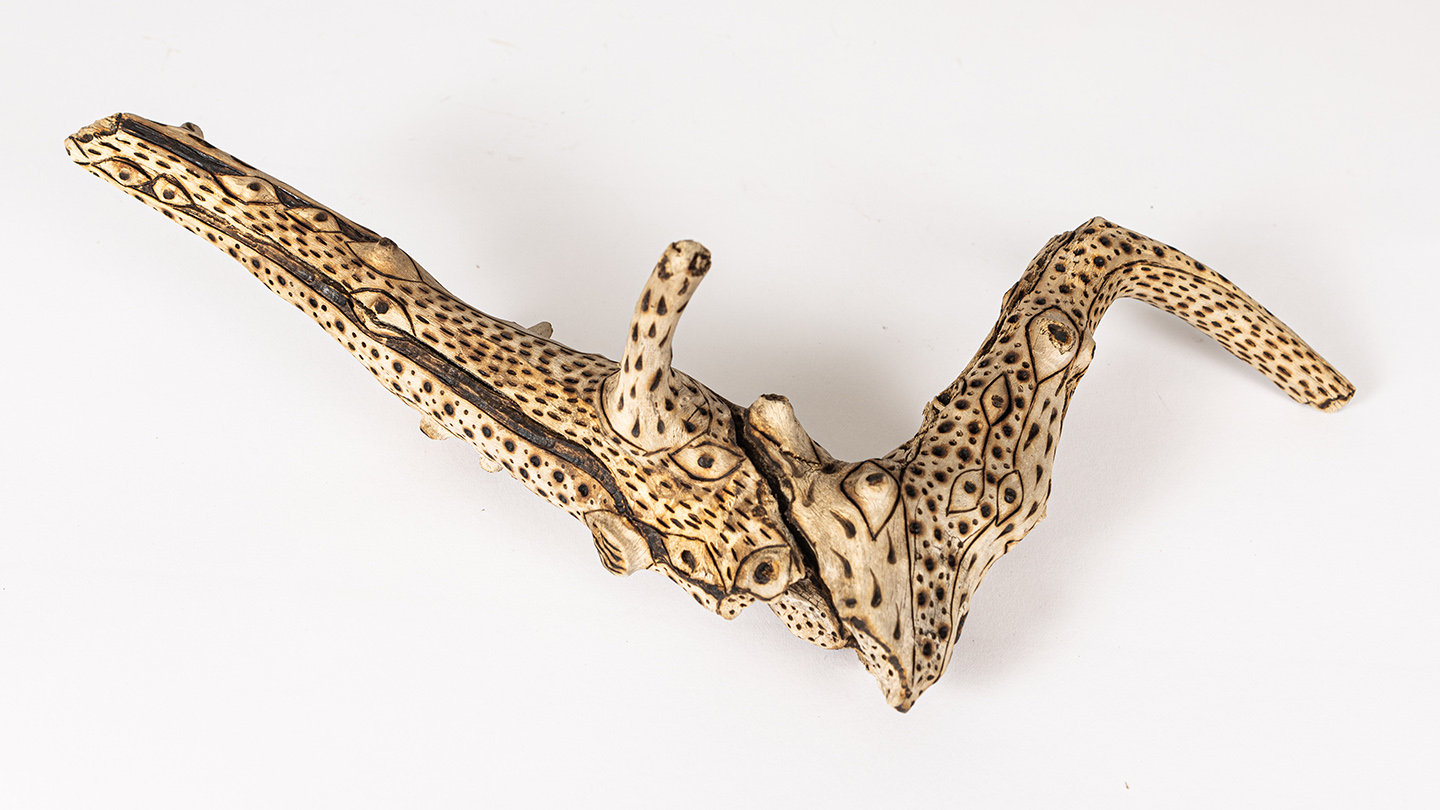 tattooed wood art piece