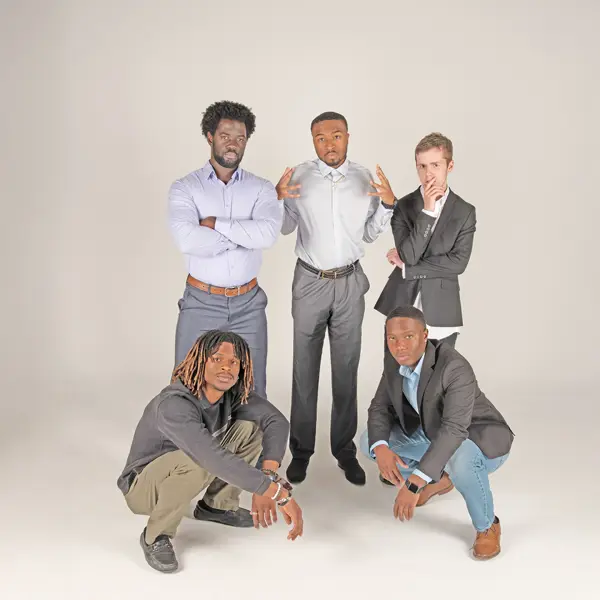 Members of the Collegiate Men of Distinction strike a pose in the photo studio