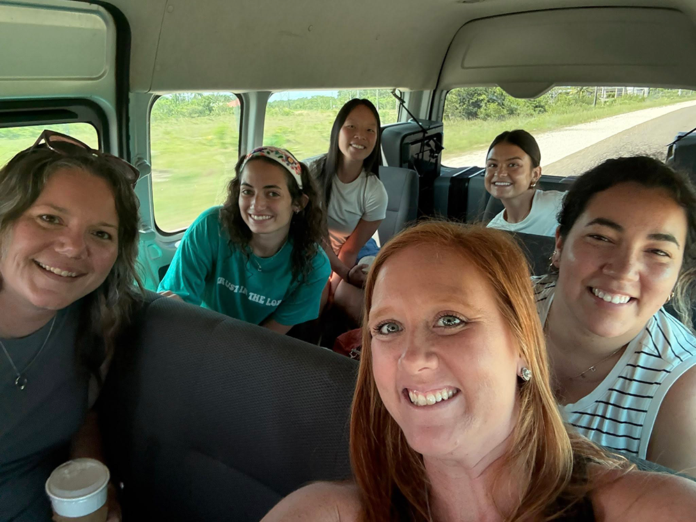 OT faculty and students in a bus