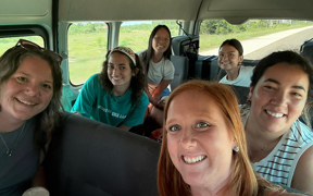 OT faculty and students in a bus
