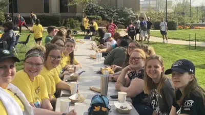 Members of the Pott College Themed Learning Community have lunch outdoors