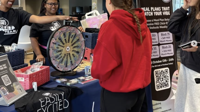 Dining Services staff educate students about meal plans at an outreach event