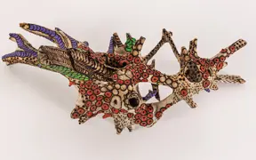tattooed wood art piece