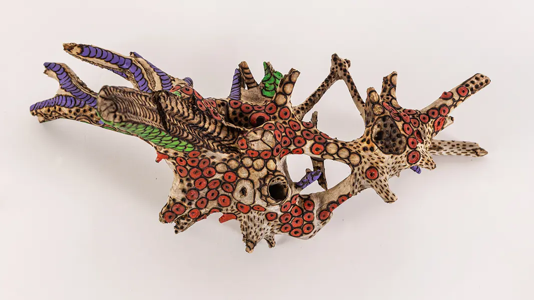 tattooed wood art piece