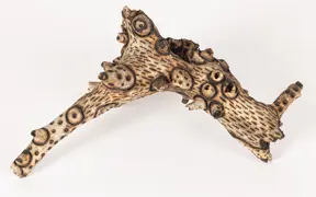 tattooed wood art piece
