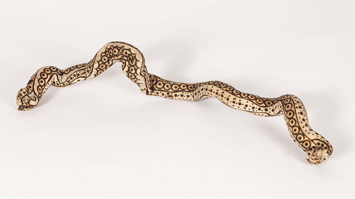 tattooed wood art piece
