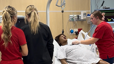 Students working in post partum simulation