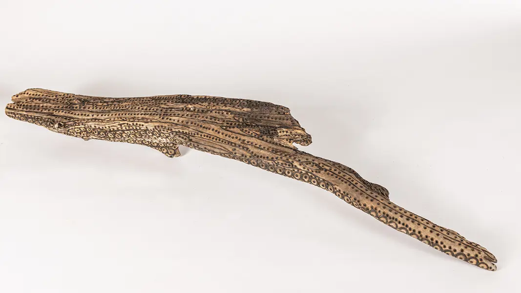 tattooed wood art piece