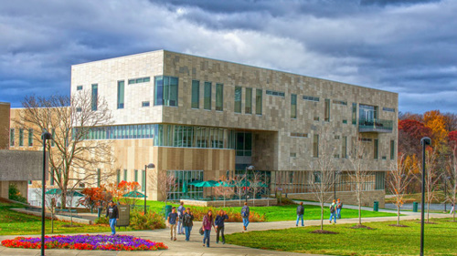 Exterior view of the Business and Engineering Center from in front of Rice Library on a cloudy day