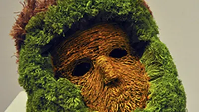 "Toxic Avenger", Sculpture. Brown mask with fluffy green framing the face