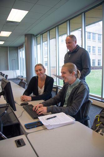 Dr. Tom Noland oversees a few students preparing to take part in the VITA program