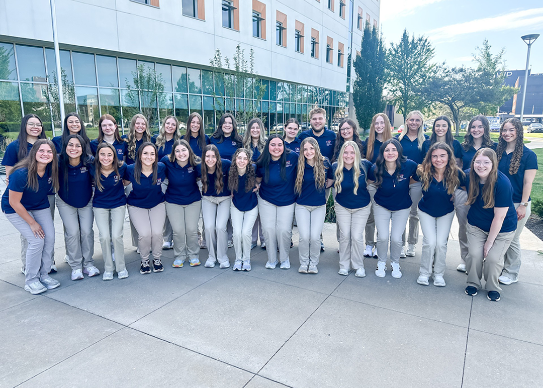 OTA Class of 2026 pose for a group photo in matching attire