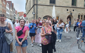 USI student tourists walk a cobblestone street in Germany
