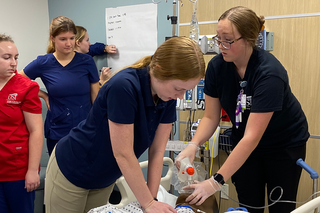 Students working together in a code blue simulation