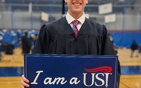 Student holding dietian sign