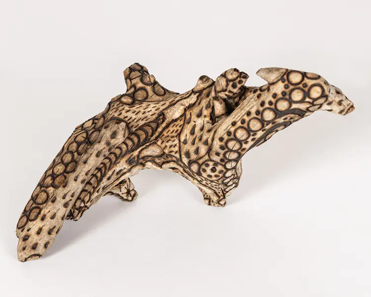 tattooed wood art piece