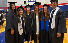 Respiratory therapy students at graduation wearing caps and gowns