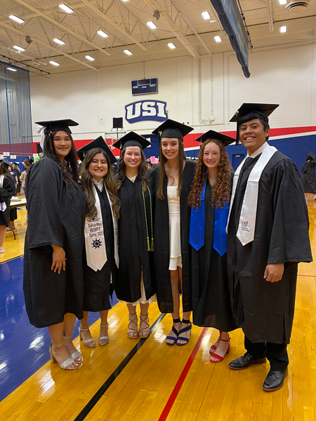 Respiratory therapy students at graduation wearing caps and gowns