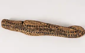 tattooed wood art piece