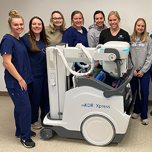 Students pose with new X-ray machine