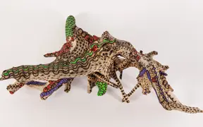 tattooed wood art piece