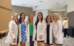 Students in white coats
