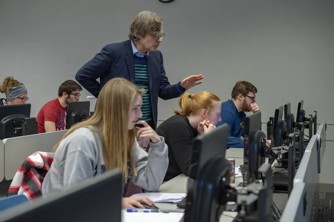 Professor with students in a classroom