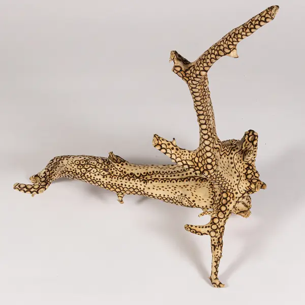 tattooed wood art piece