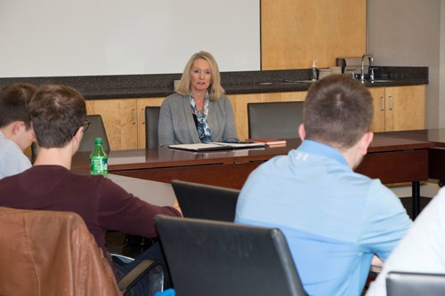 Miller talks to students