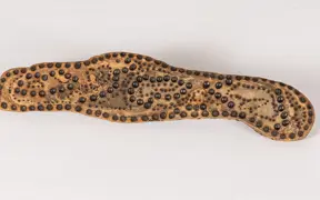 tattooed wood art piece