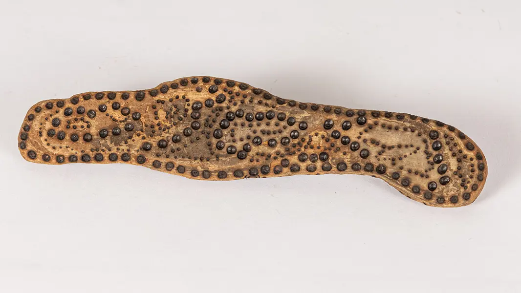 tattooed wood art piece