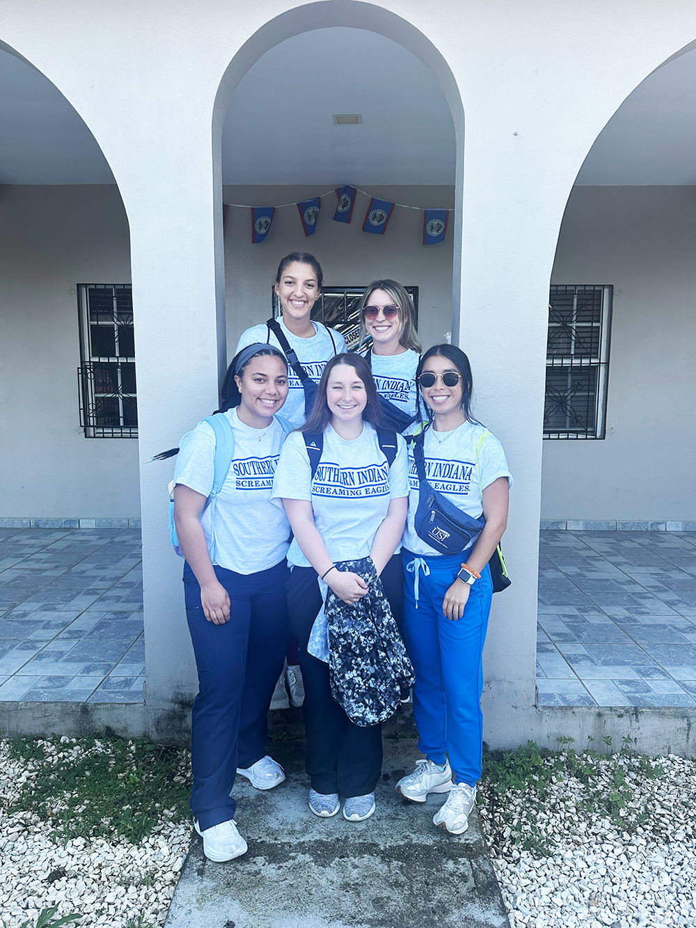 OT students in Belize wearing USI T-shirts
