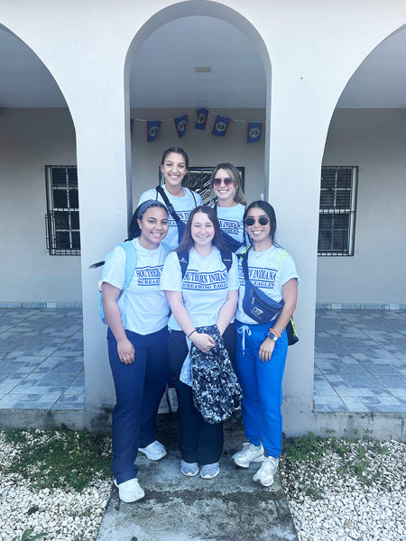 OT students in Belize wearing USI T-shirts