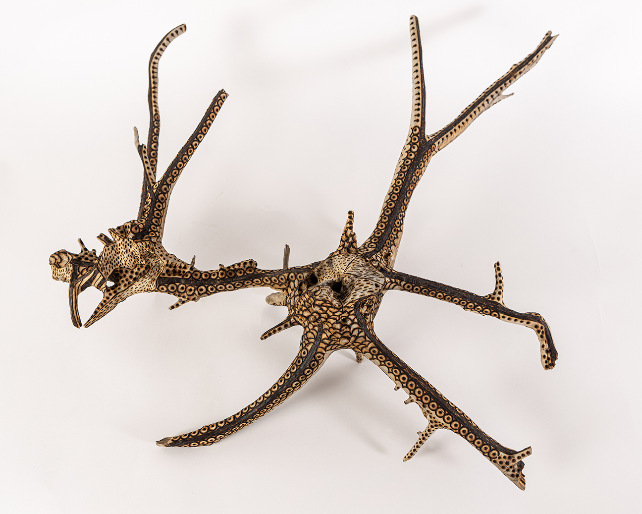tattooed wood art piece