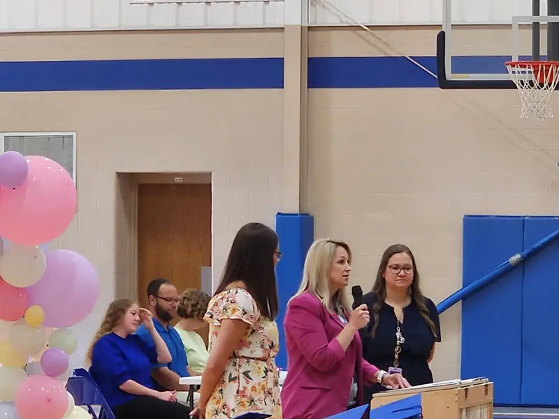Principal Davis speaking at a school program.