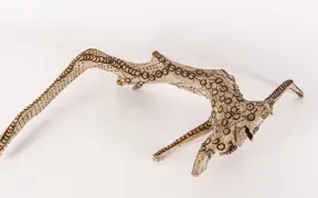 tattooed wood art piece