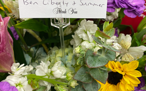 Photo of a bouquet of flowers and thank you card